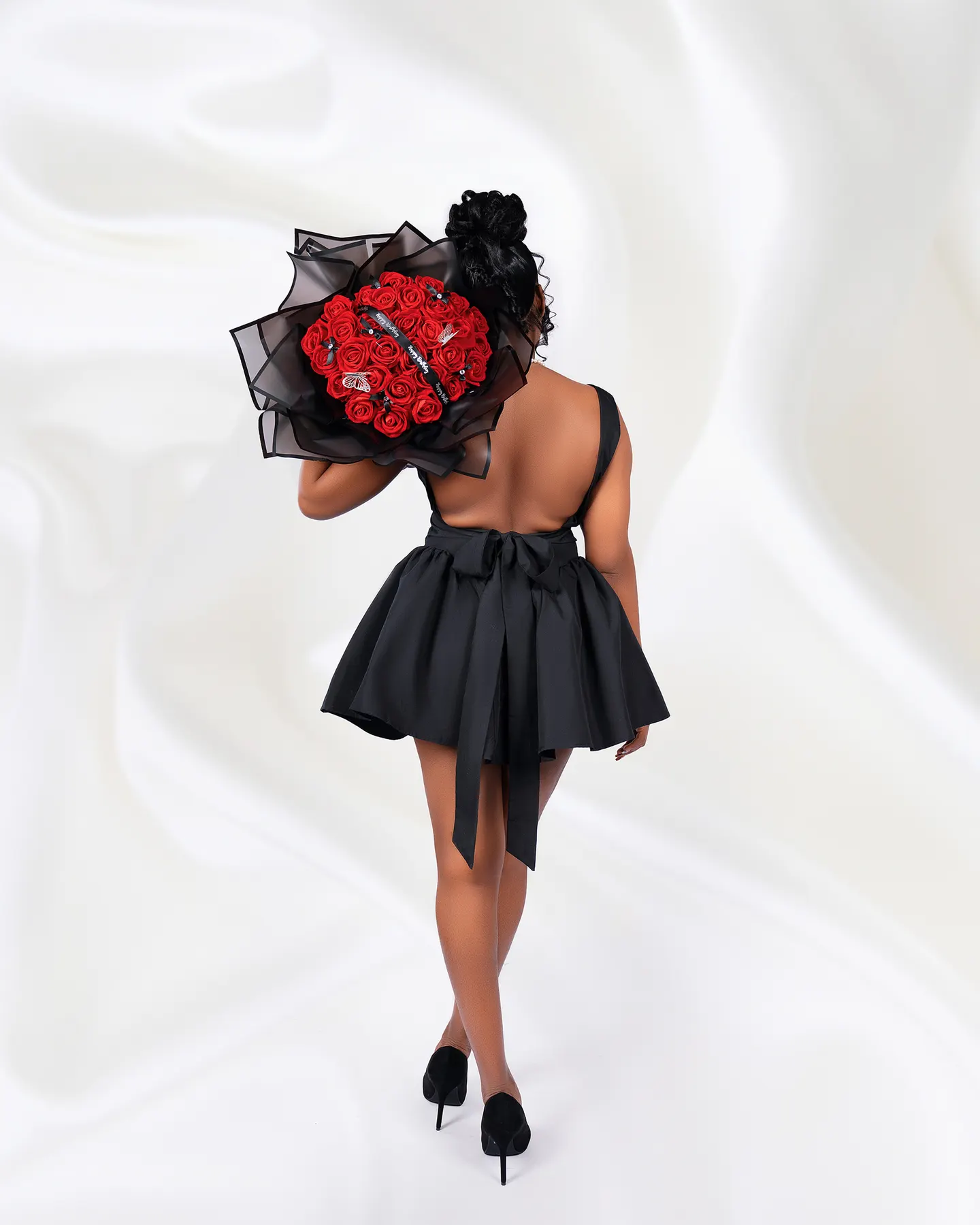 Birthday portrait with a rose bouquet, studio session
