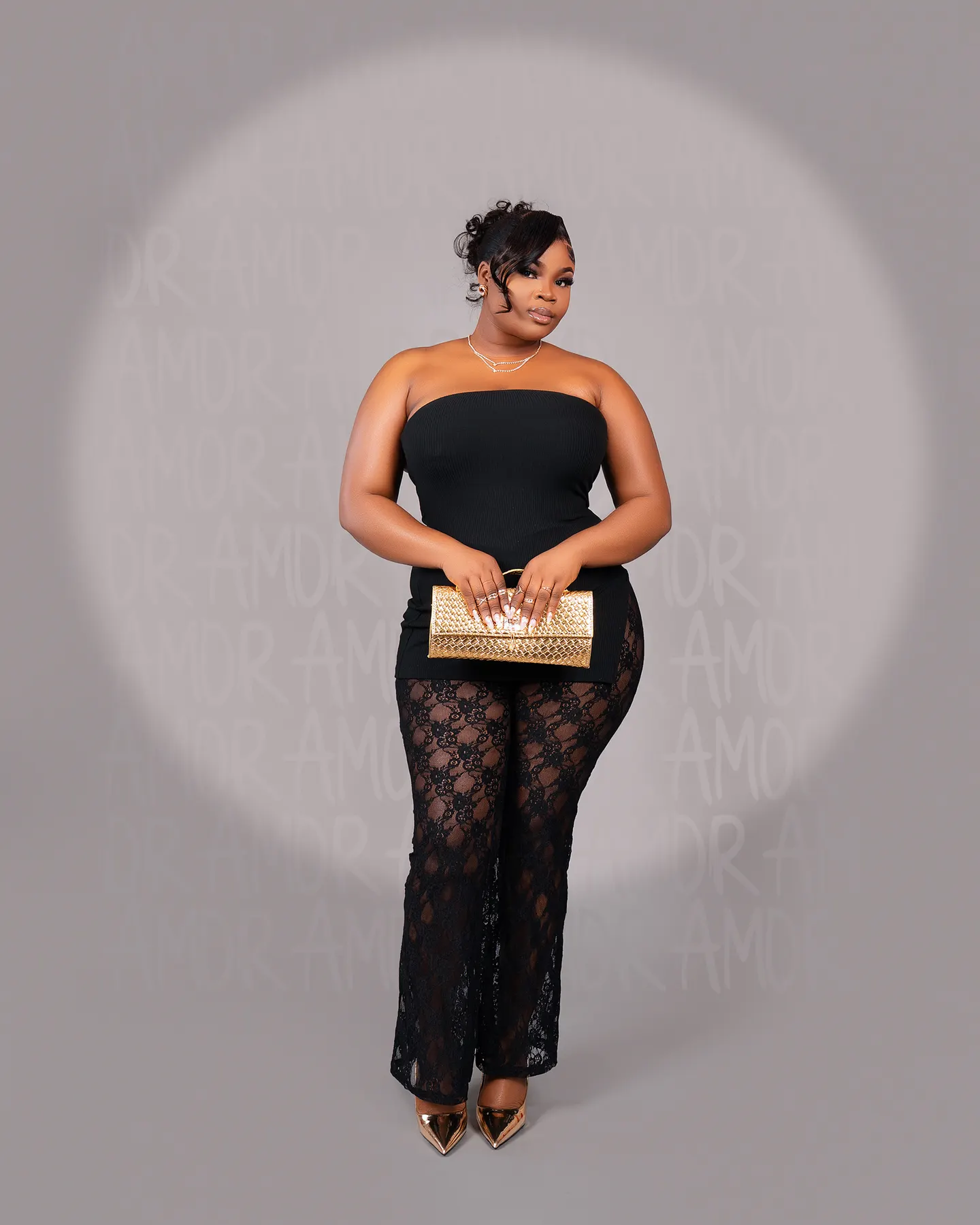 Fashion portrait with a gold clutch, studio session